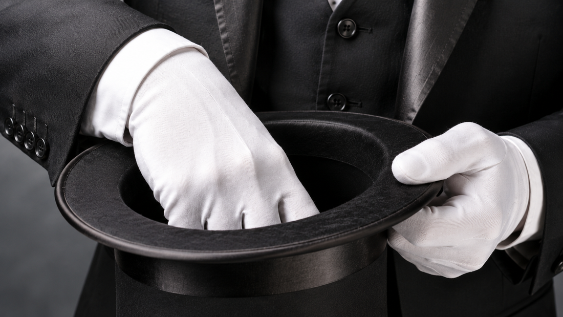 Magician reaching into a top hat, representing the misconception that AI is a magic fix for Shopify stores